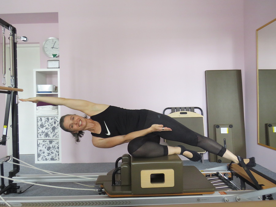 Woman performing an exercise on Reformer